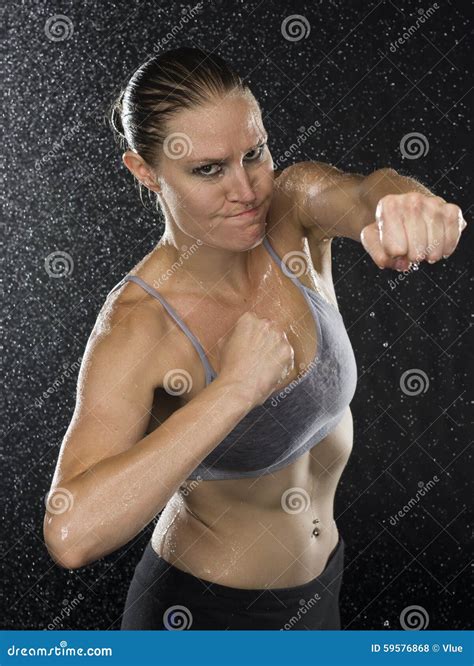 Female Fighter in Punching Pose Looking Aggressive Stock Photo - Image of force, fight: 59576868