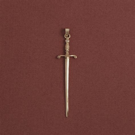 gold sword pendant ruby star