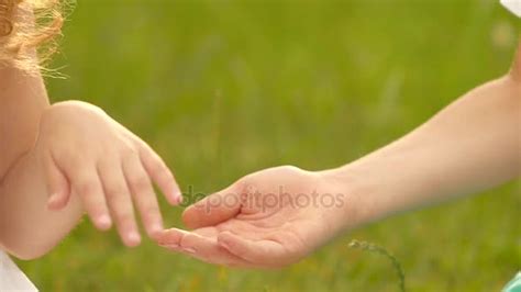 Little girl gives her hand to the boy. Slow motion. Close up — Stock ...