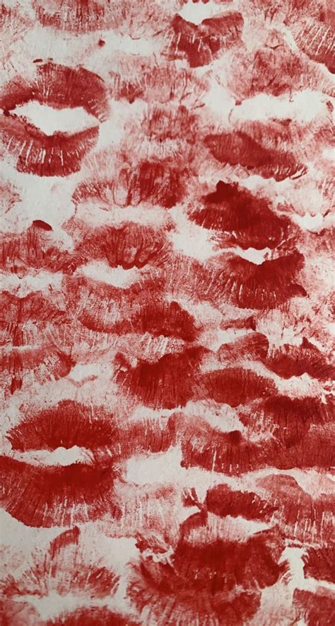 a red and white painting with lots of black dots on it's surface,