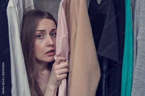 scared woman mistress hiding   closet portrait close  secret