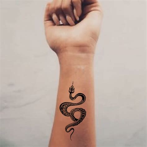 snake wrapped around arm tattoo 9