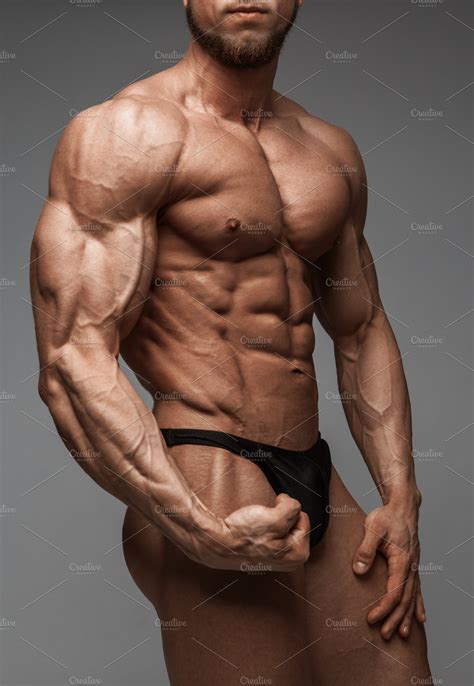 Bodybuilder man with perfect abs containing muscle, bodybuilder, and