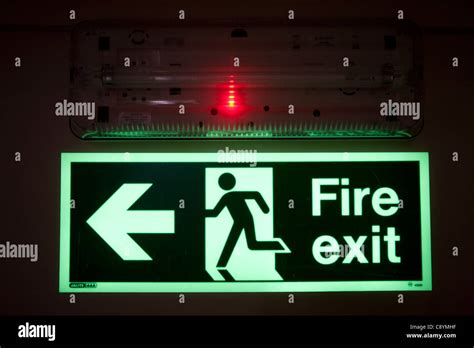 Emergency Exit Light with an luminous fire exit sign Stock Photo - Alamy