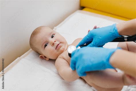 pediatrician  examining  newborn baby   hospital pediatrician
