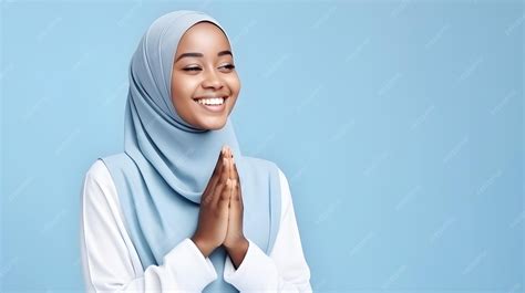 south east asia muslim woman praying  god  hands   blue