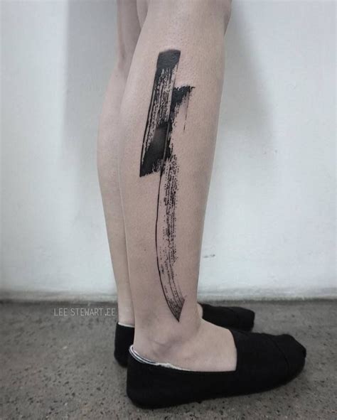 Abstract black tattoo on the right calf - Tattoogrid.net