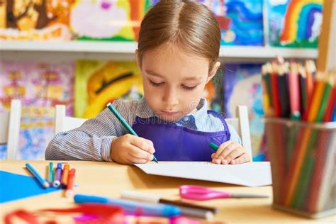 Little Girl Drawing in Pre-School Stock Image - Image of school ...