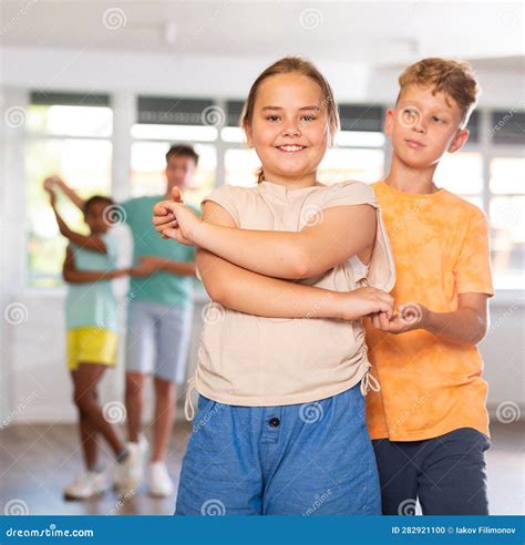 Light-skinned Boy and Girl Dance in Pairs and Rehearse Dance before ...