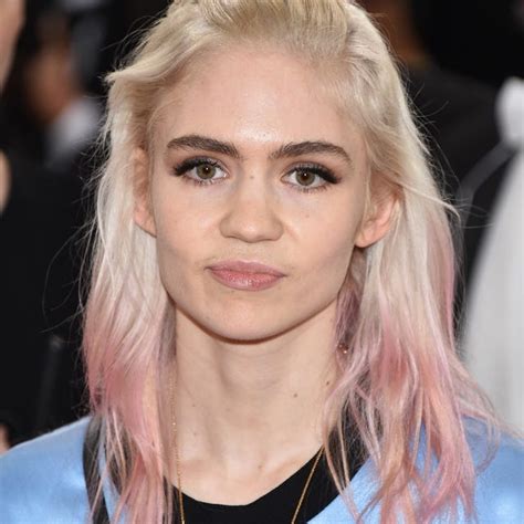 Grimes has a new white ink back tattoo to resemble 'alien scars'