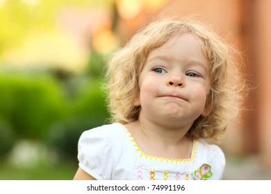 Little Girl Making Funny Faces Stock Photo (Edit Now) 74991196