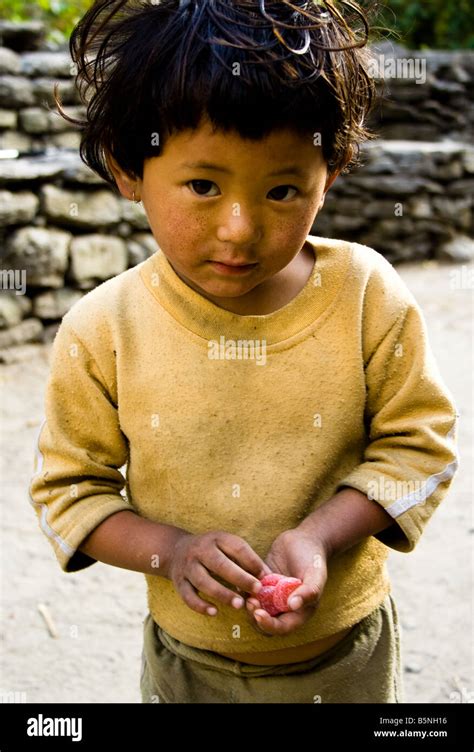 Nepali Child with Sweets Stock Photo - Alamy