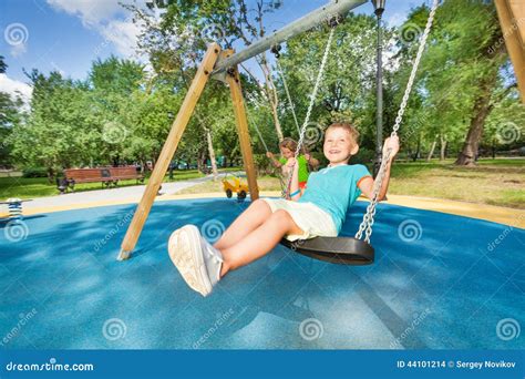 boy  girl   swings stock photo image  happy