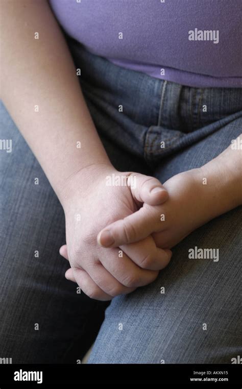 persons folded hands stock photo alamy