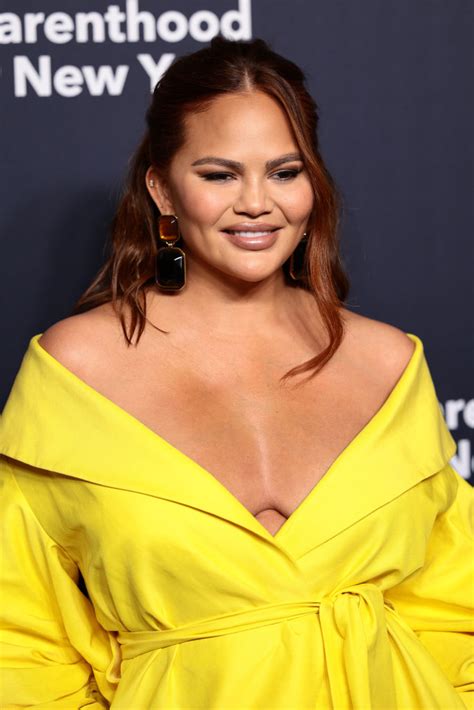 Chrissy Teigen Shines in Bright Yellow Dress at Planned Parenthood