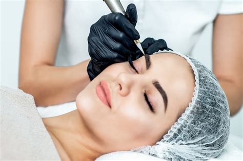 Premium Photo | Permanent makeup on eyebrows.