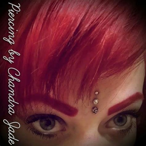 Triple third eye piercing #piercingbychandrajade #piercings #dermals # ...