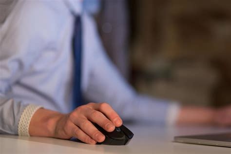 Hand using computer mouse closeup 12446485 Stock Photo at Vecteezy
