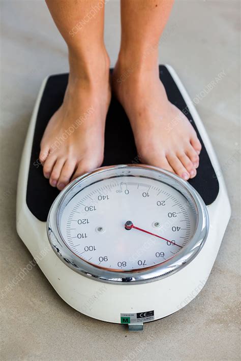 woman standing   scale stock image  science photo library