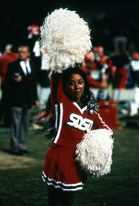 Cheerleader performing during halftime in the 1980s. | Cheerleading