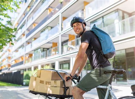 Bike Courier Making a Delivery Stock Photo - Image of biking, boxes ...