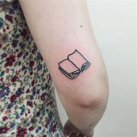 Open book tattoo by Suki Lune - Tattoogrid.net