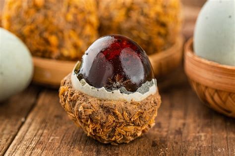 premium photo preserved duck eggs  century egg  wood background
