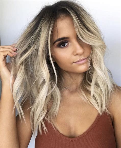 The dark roots blonde hair look is surprisingly easy for any stylist 1
