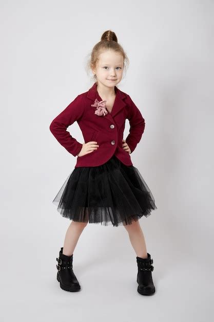 Premium Photo | Beautiful little girl in stylish clothes