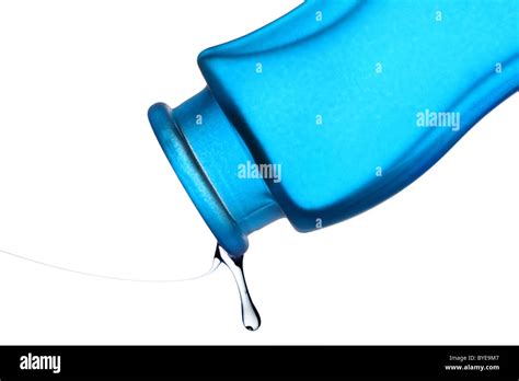 last droplet of liquid from blue bottle Stock Photo - Alamy