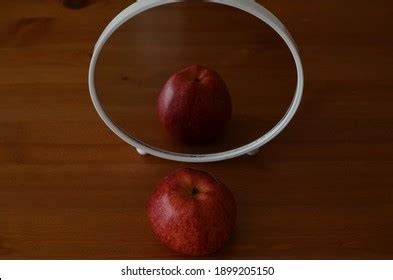 Red Apple Mirror Image On Wooden Stock Photo 1899205150 | Shutterstock