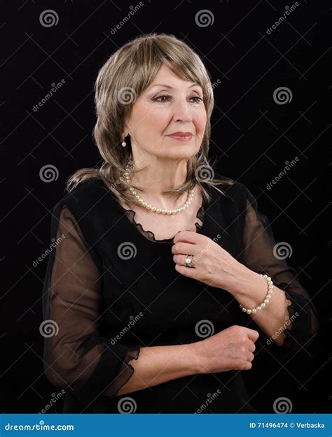 Picture of Gorgeous Older Woman Posing with Imitation Pearl Set Stock