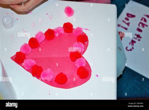 Childs hands while making homemade valentines day cards arts and crafts ...