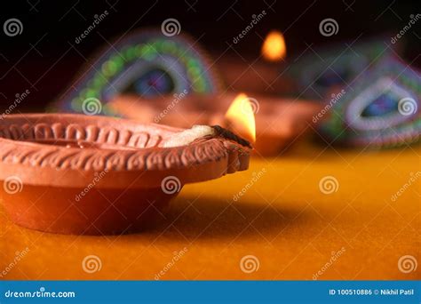 Rangoli Design Around Diwali Lamp Stock Photo - Image of colorful, fire ...