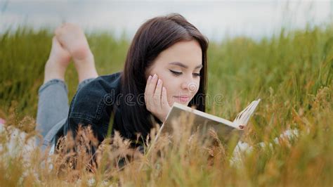 Young Attractive Brunette Caucasian Woman Girl Lying on Grass Pretty