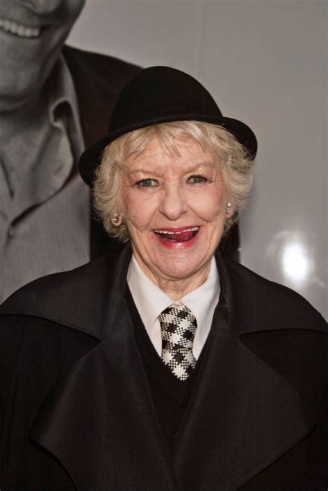 Download Elaine Stritch In Black Cap And Coat Wallpaper | Wallpapers.com
