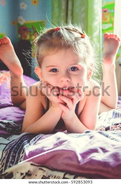 Beautiful Little Girl Lying On Bed Stock Photo 592853093 | Shutterstock