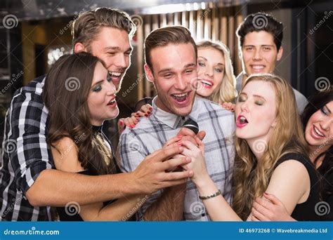Happy Friends Singing Karaoke Together Stock Photo - Image of cheerful ...