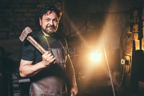 portrait  blacksmith preparing  work metal   anvil stock image