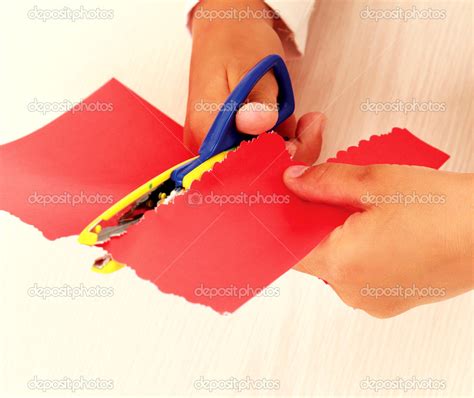 Man's hand is cutting paper with scissors Stock Photo by ©Lenets ...