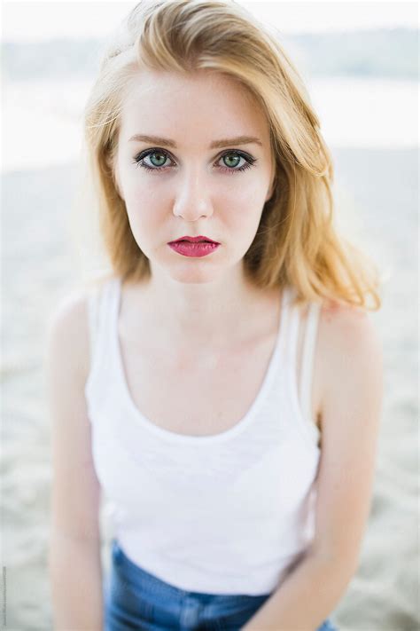 "Portrait Of A Beautiful Young Woman With Green Eyes" by Stocksy