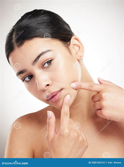 Beauty, Woman and Press Pimple in Studio for Skincare Breakout, Acne