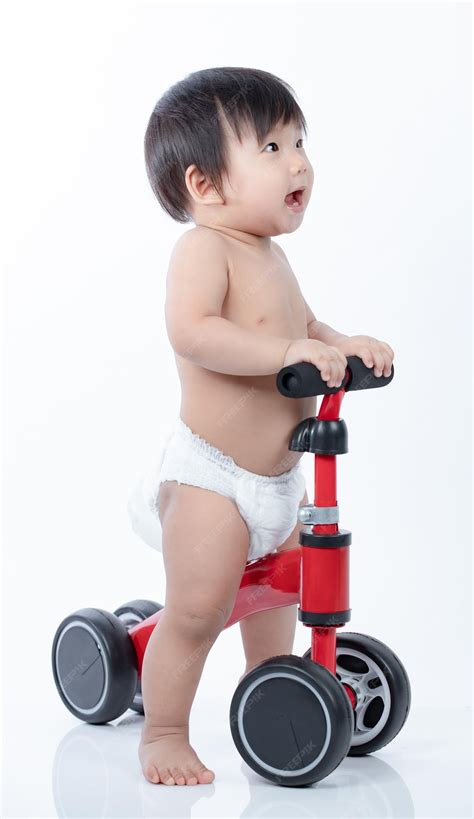 Premium Photo | Cute baby on a runner learns to keep balance run bike ...