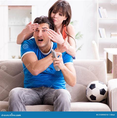 Wife Unhappy that Husband is Watching Football Stock Photo - Image of