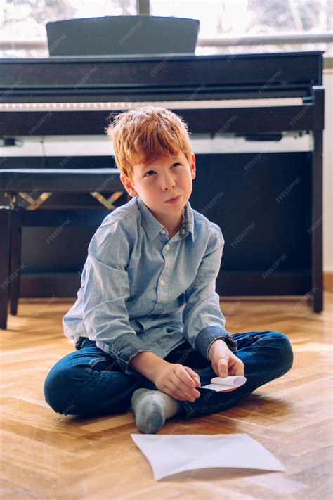 Premium Photo | Small kid grounded without school doing educational ...