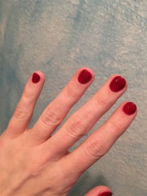 red fingernails painted  photo  pixabay