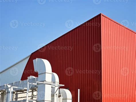 air flow systems  red warehouse  blue sky background