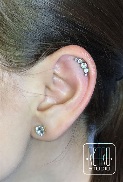 The helix piercing with titanium cluster | Earings piercings, Helix ...