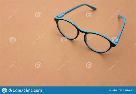 blue eye glass side view  brown background stock photo image