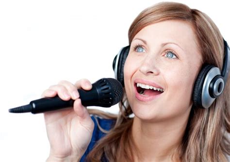 Premium Photo | Delighted woman listening music with headphone and singing